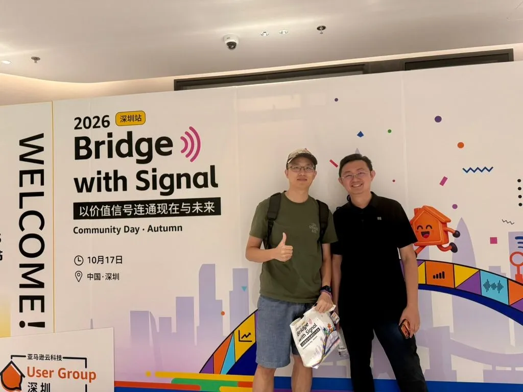Catching up with friends in Shenzhen Sheng and a friend at the Bridge with Signal backdrop.